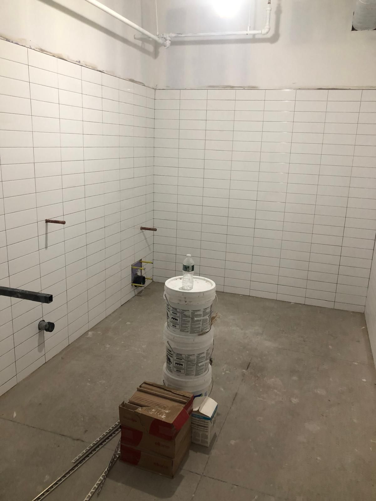 Commercial restroom tile renovation by MJ Stone and Tile