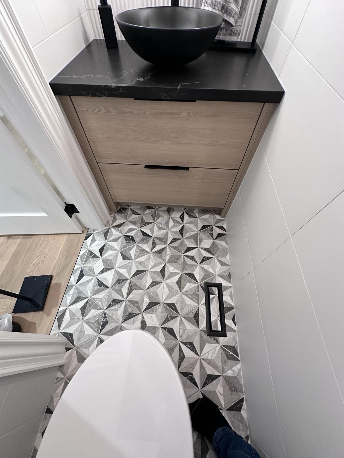 Decorative bathroom floor tile installation