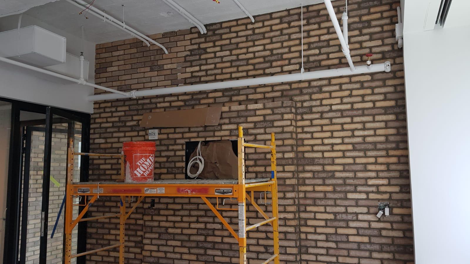 Commercial brick feature wall installation