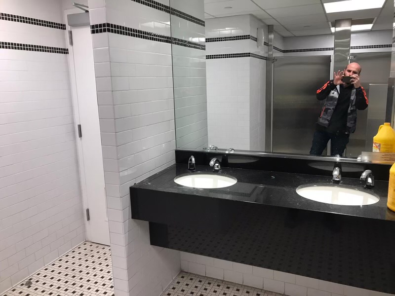 Commercial restroom wall tile floor tile and vanity installation