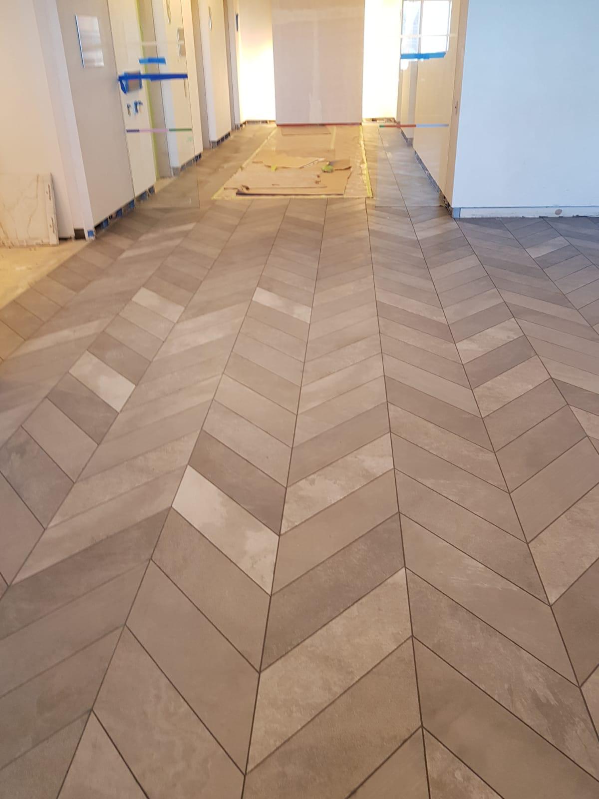 Chevron floor tile installation