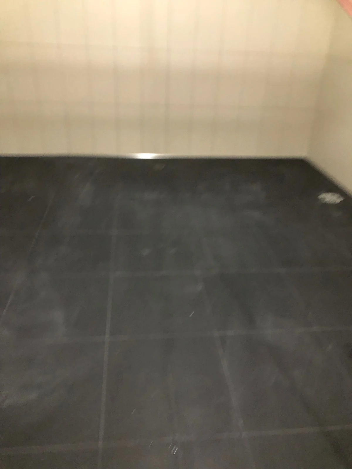Finished dark commercial tile floor
