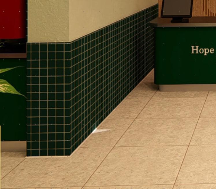 Green wall tile and pale floor tile at Wonder